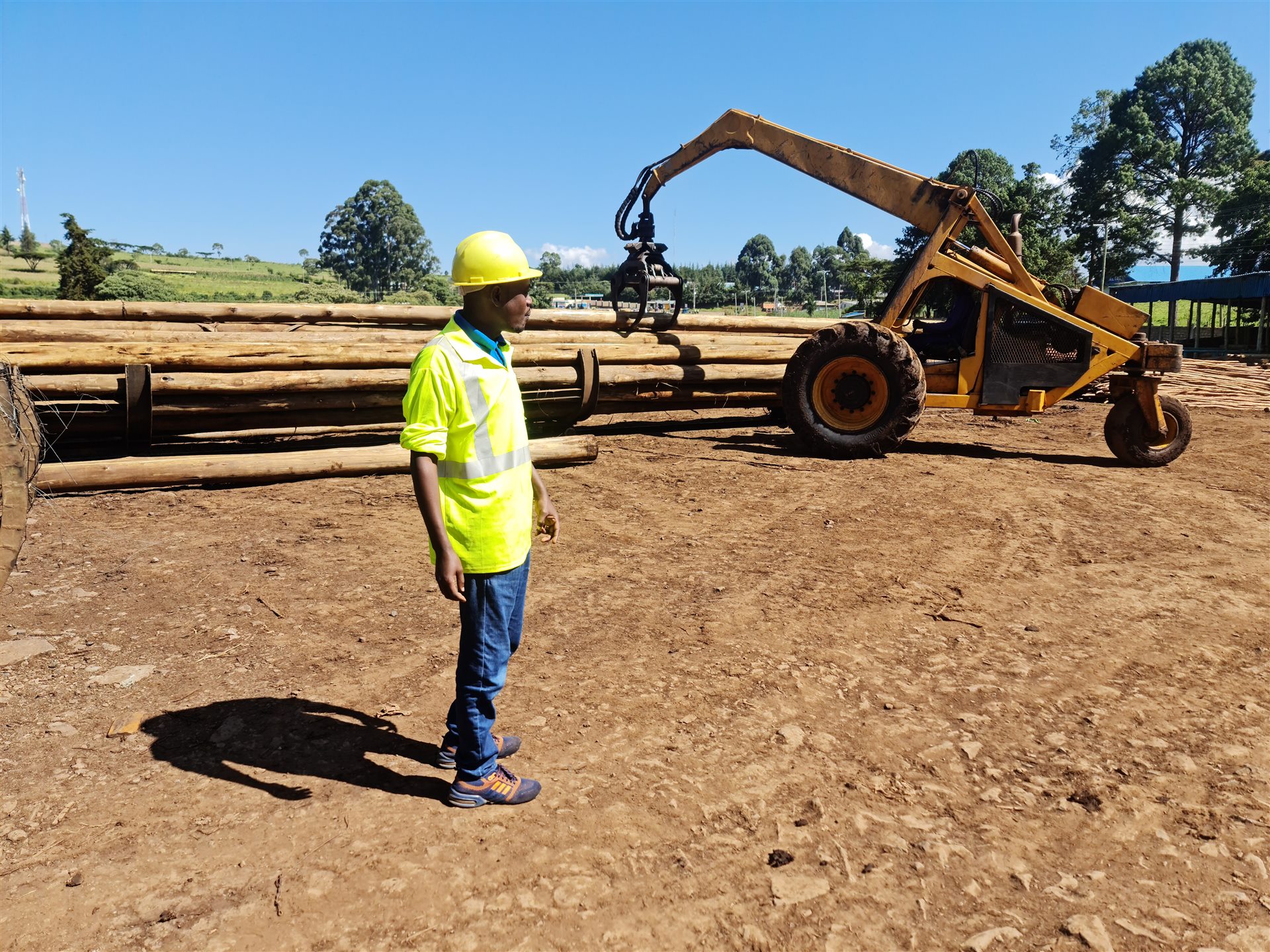 Brookewood team member overseeing timber pole operations